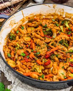 a pan filled with food sitting on top of a table