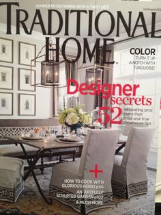 the front cover of traditional home magazine, featuring an elegant dining room with white chairs