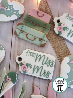 decorated cookies are arranged on a wooden table