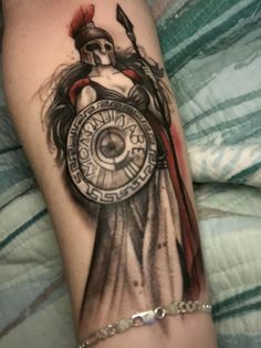 a woman with a clock tattoo on her arm