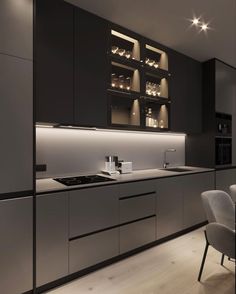 a modern kitchen with black and white cabinets