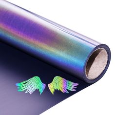 a roll of metallic foil with wings on it