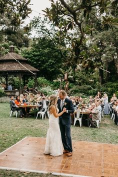 a bride and groom sharing their first dance