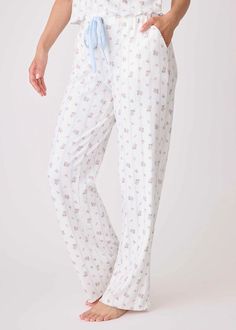 Love lounge life in high-waisted floral print pointelle pants. Designed with a body-flattering high waist and crafted from the world's softest pointelle fabric adorned with a charming floral print, these pants offer both comfort and romance. Merrow edge hem. Faux snap boxer placket. 95% Polyester, 5% Elastane Double Brushed Pointelle. Model is wearing a size S. Pointelle Pants, Pointelle Fabric, Faux Snap, Crazy In Love, Pajama Pant, Ruffle Mini Dress, Sleepwear & Loungewear, High Life, Love Is Free