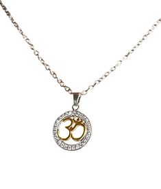 Om Charm Pendant with Chain (925 Silver with Gold Plating) Material: Base: 925 Sterling Silver (durable, hypoallergenic for most people) Accents: 14k yellow gold plating (for a touch of elegance) on specific elements Design: Pendant: 925 Silver Om symbol in a delicate design (cut-out, etched, etc.) Chain: 925 Sterling silver chain with a spring clasp closure Perfect for: Those who follow Hinduism, Buddhism, or appreciate the spiritual meaning of Om Layering with other necklaces for a personalized look A meaningful gift for someone who enjoys yoga or meditation Note: Gold plating adds a touch of luxury but can wear off over time with exposure to chemicals (perfume, lotions) . Proper care (storing in a pouch, avoiding harsh chemicals) can extend the life of the plating. Spiritual Silver Charm Necklace As Gift, Spiritual Silver Necklace With Adjustable Chain, Symbolic Silver Necklace With Adjustable Chain, Symbolic Silver Pendant Necklace, Symbolic Pendant Necklace With Silver Chain, Silver Spiritual Charm Necklace With Adjustable Chain, Spiritual Silver Charm Necklace With Adjustable Chain, Personalized Spiritual Silver Charm Necklaces, Silver Symbolic Charm Necklace With Round Pendant