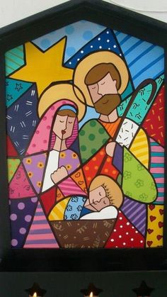 the nativity scene is depicted in this stained glass painting, which depicts mary and jesus