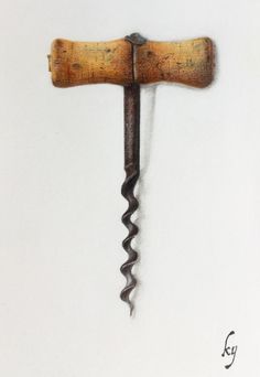 an old corkscrew hanging from the side of a white wall with writing on it