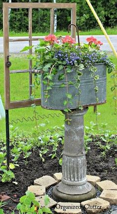 a potted planter sitting in the middle of a garden