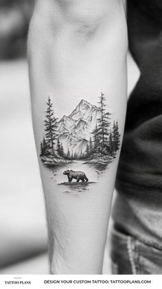 a man's arm with a bear tattoo on it and trees in the background