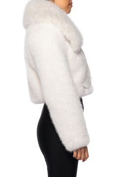 Amp the textural drama of your cool-weather wardrobe with this luxe faux-fur jacket that's perfect for a night on the town. Hidden front closure Spread collar Side-seam pockets 100% polyester Dry clean Imported Asian Owned/Founded Fur Coat With Hood, Secretary Bird, White Faux Fur Jacket, Slippers Outfit, White Faux Fur Coat, White Fur Coat, Feminine Outfits, Faux Fur Hoodie, Faux Fur Cropped Jacket