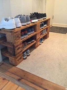 there are many pairs of shoes on display in the store's shoe storage area