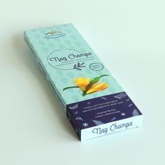 a carton of tea with a yellow flower on it