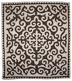 a black and white rug with an intricate design