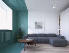 a living room filled with furniture and green walls