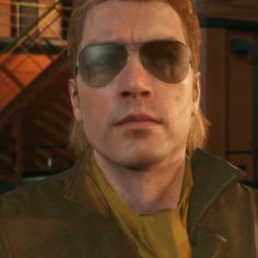 a man wearing sunglasses and a leather jacket in the video game hitman's tale