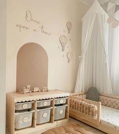 a child's room with two wooden beds and toy storage bins on the floor