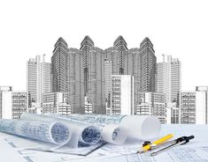 architectural drawings and construction tools on top of blueprint with skyscrapers in the background