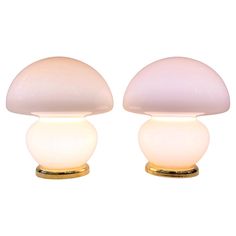 two white lamps sitting on top of each other