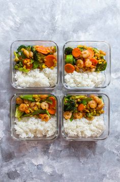 four plastic containers filled with rice and veggies