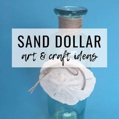 a bottle filled with sand and rope on top of a blue background that says sand dollar art & craft items