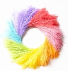 multicolored furry wreath on white background