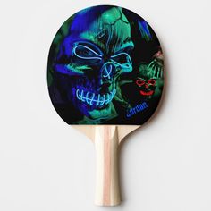 a ping pong paddle with an image of a skeleton on it