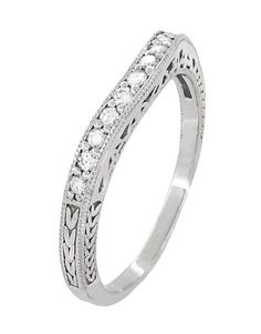 a white gold wedding ring with diamonds