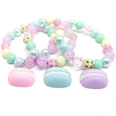 These adorable bracelets are the perfect favor for your little one's macaroon themed party! Each bracelet features a pastel resin macaroon charm, resin rhinestone beads and an assortment of pastel 10mm acrylic beads strung with durable stretch floss cord. You will receive a mix of charm colors. Each bracelet will arrive individually packaged in organza bags. Please select the number of bracelets and bracelet size needed from the drop down menu. Please message me if you have any questions. These Pink Bracelet For Party Favors, Adjustable Kawaii Beaded Bracelet For Birthday, Cute Round Beads Jewelry For Party Favors, Sweet Adjustable Charm Bracelet For Gift, Sweet Adjustable Charm Bracelet As Gift, Trendy Plastic Jewelry For Birthdays, Sweet Multicolor Party Jewelry, Playful Pink Charm Bracelet For Birthday, Plastic Bead Jewelry For Birthday