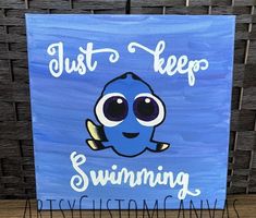 a blue sign that says just keep swimming with an image of a cartoon character on it