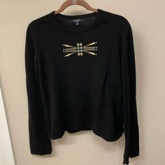 Burberry London Union Jack Nova Check Cashmere Sweater Made In Italy. Size Large. Beautiful Sweater In Overall Good Condition, Does Have Slight Cracking Of Graphic On Front Of Sweater. Approximate Measurements: Armpit To Armpit: 20.5”, Shoulder To Bottom Of Top: 22”. Does Have Some Stretch To It. Burberry Tops, Burberry Sweater, Burberry London, Beautiful Sweater, Sweater Making, Union Jack, Cashmere Sweaters, Burberry, Overalls