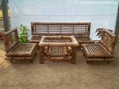 a set of wooden furniture sitting on top of a dirt field