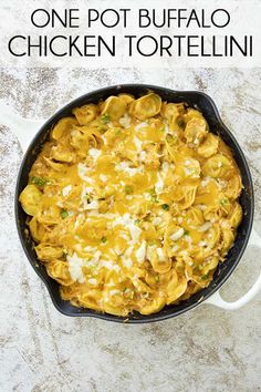 one pot buffalo chicken tortellini in a cast iron skillet with text overlay