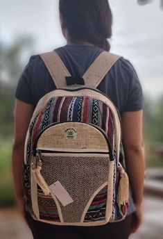 "Namaste Natural Hemp Fashionable Nepali Unisex Handmade Organic Vegan Eco-Friendly Backpack. Hemp fabric is made by hand on a loom, it is completely handmade backpack and is made in Nepal with love and care. Backpack is made up of Hemp and natural cotton inside. No child labor is used and is fairly traded. No harmful chemicals has been used. Each print in the backpack represents rich art in Nepal, the print looks unique and special and the color represents old and colorful culture of Nepal. It Eco-friendly Handmade Backpack, Eco-friendly Handmade Rectangular Backpack, Handmade Multicolor Casual Backpack, Casual Handmade Multicolor Backpack, Casual Multicolor Handmade Backpack, Eco-friendly Multicolor Rectangular Backpack, Eco-friendly Rectangular Multicolor Backpack, Hemp Backpack, Eco Friendly Backpack