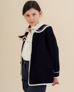 Introducing the Diana Blouse in Off White Plumetis, a timelessly elegant piece perfect for welcoming the season with sophistication. Crafted from delicate cotton for unbeatable comfort, this long-sleeved blouse features a frilled collar and placket, frilled shoulders and delicate mother-of-pearl buttons for a luxurious finish. The Diana Blouse is the perfect addition to your little girl's wardrobe, instantly elevating her look with chic, understated appeal. This blouse combines classic style wit Frilled Collar, Baby Boy Shirts, Girls Special Occasion Dresses, Sailor Style, Navy Coat, Sailor Fashion, Hand Smock, Style Coat, Christening Gowns