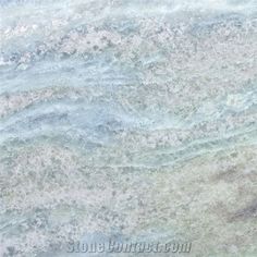 an image of some water that is blue and green with white streaks on it's surface