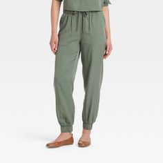 Women's High-Rise Joggers - Universal Thread™ Olive Green S Solid Tapered Leg Sweatpants For Spring, Solid Color Spring Sweatpants With Tapered Leg, Spring Solid Cargo Pants With Elastic Waistband, Spring Solid Color Tapered Leg Sweatpants, Versatile Spring High-waisted Sweatpants, Spring Versatile High-waisted Sweatpants, Spring Workwear Sweatpants With Pull-on Style, Versatile Pants With Elastic Waistband, Versatile Pants With Elastic Waistband For Daywear