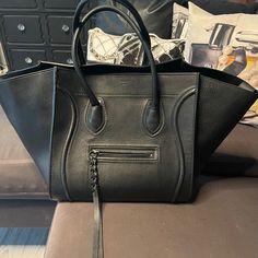 100% Authentic Celine Luggage Tote In Black. No Rips Or Tears. Biggest Flaw Is The Handles Are Relaxed, But They Can Definitely Be Fixed. There Is Some Scraping On The Glaze (Trim) . Please See All Pictures. Bag Is Still In Very Good Condition And Still Has A Lot Of Wear Left To It. Celine Cabas Black Tote, Celine Tote Bag, Celine Tote, Celine Handbags, Celine Luggage, Classic Handbags, Zip Tote, Tassel Bag, Celine Bags