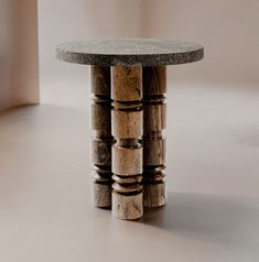 a small table made out of wood and concrete