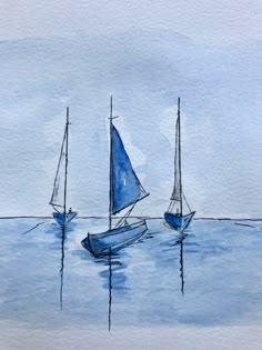 three sailboats floating in the water on a cloudy day, one blue and one white