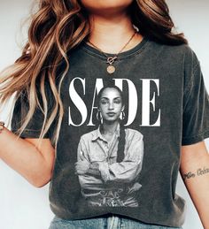 Sade Adu Shirt, Sade Adu World Tour Tshirt, Sade t shirt ,Sade Adu Unisex Tshirt, SADE Tour Crewneck Tshirt, Sade Pop Music Fan shirt : 100% Cotton (fiber content may vary for different colors) .: Medium fabric (5.3 oz/yd² (180 g/m .: Classic fit .: Runs true to size HOW TO ORDER Pick you favorite design. Review the size & color charts above FIRST and then select shirt size and color from the dropdown menu. Indicate the birthday year in the personalization box. Please note size measurements for Sade T Shirt, Sade Tshirt Outfit, Sade Shirt, Sade Adu Diamond Life, Sade Tshirt, The Best Of Sade Album Cover, Sade Adu Love Deluxe Poster, Love Deluxe, Sade Adu