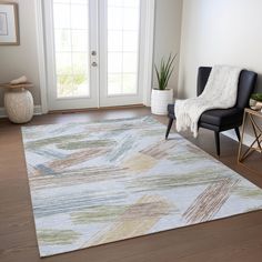 a living room with a chair and rug on the floor