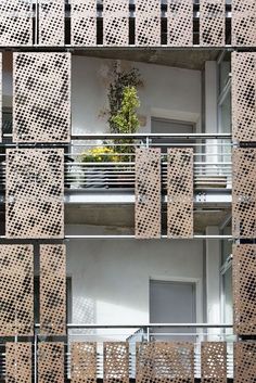 an apartment building with multiple balconies on each floor