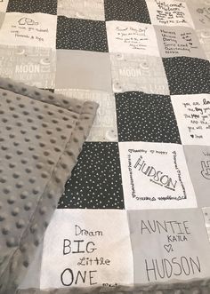 a quilted blanket with some writing on it