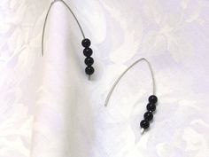 "Simple modern black onyx earrings! Handcrafted earrings made from 14k Gold Filled or 925 sterling silver wire! Elegant V shape hand crafted earrings adorned with black onyx round stones! - 14k Gold Filled (not plated) or 925 Sterling Silver wire (20gauge) - Black Onyx 4mm - Earring length is approx. 37mm = 1 1/2\" - Comes in a cute little organza bag! - If you prefer a gift box, ready for gift giving, please browse here: https://www.etsy.com/listing/248159830/cute-gift-box?ref=shop_home_active_ Modern Black Earrings For Anniversary, Handmade Black Earrings For Anniversary, Minimalist Black Earrings For Anniversary, Black Linear Earrings For Pierced Ears As Gift, Minimalist Onyx Round Bead Jewelry, Elegant Black Sterling Silver Hoop Earrings, Black Faceted Bead Earrings For Gift, Minimalist Black Sterling Silver Earrings, Modern Onyx Earrings With Black Enamel