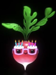 a red apple with glasses and a green plant in the shape of a human head