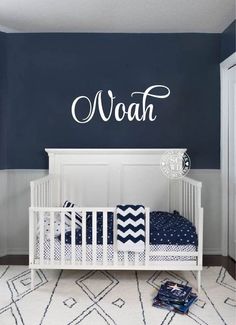 a baby's room with blue walls and white crib