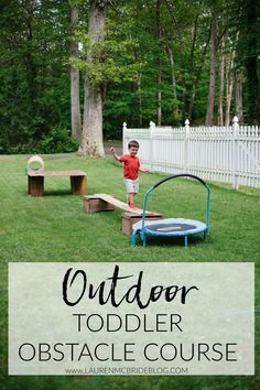 a little boy playing in the yard with a trampoline and obstacle course for toddlers