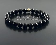 ❤️ All Bracelets are Crafted from High Quality GENUINE Gemstone Beads sourced from Reputable Healing Crystal Suppliers. You are buying a Handmade High Quality Gemstone Stretch Bracelet  Handmade with Lots of Love & Positive Energy Includes:  Strong Durable Stretch Cord White Organza gift bag Detailed Crystal Information  Crystal Gemstone Care Information ALL Crystal Jewelry is Cleansed and Charged Before Shipping. Genuine Black Obsidian Healing Crystal Bracelet  with 14K Gold Filled Bead  Choose Hypoallergenic Black Round Bracelets, Elegant Black Hypoallergenic Beaded Bracelets, Elegant Black Hypoallergenic Bracelets, Classic Onyx Bracelets As Gift, Black Obsidian Bracelet, Obsidian Jewelry, Pyrite Bracelet, Black Obsidian Stone, Bracelet Gift Box