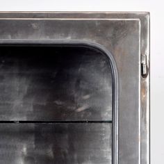 an old fashioned metal oven with the door open