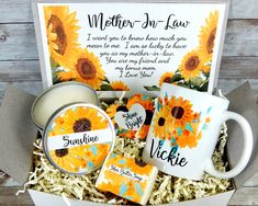 a sunflower themed gift box with mugs, cookies and cards for someone's special day